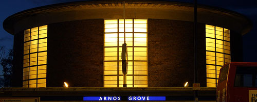 Arnos Grove underground station by night.