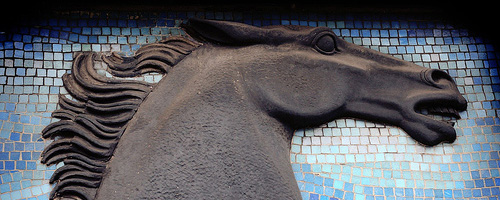 Mosaic showing a black horse.