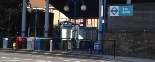 The outside of Bow Church station, with sign.